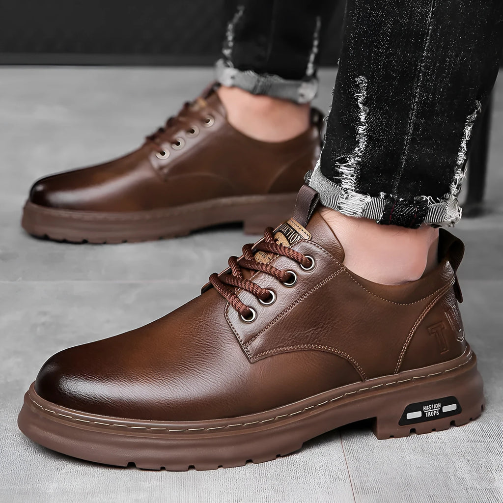 Men's black retro casual shoes with round toe, flat square heel, and decorative stitching on the PU upper.