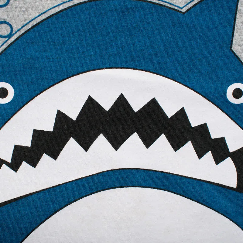 Grey children's cotton T-shirt laid flat, showing size tag with centimetre measurements.