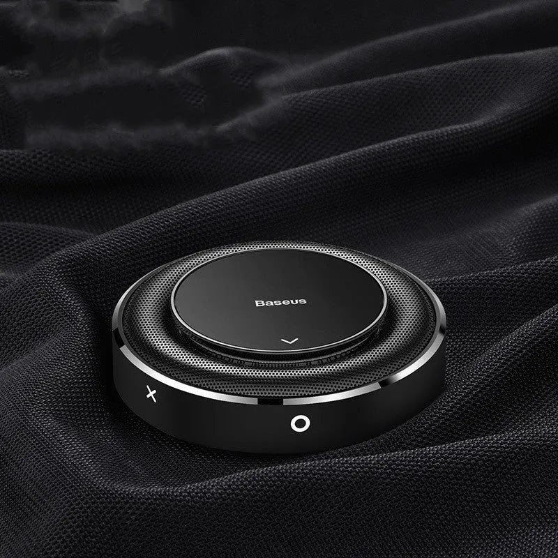 Round aluminium alloy car fragrance seat in black, red, and silver colours with four aromatherapy tablets.