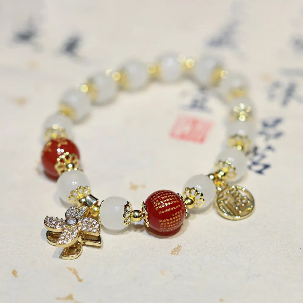 Women's Chinese style glass bracelet with safety lock, fu character, windmill, bamboo, and jade charm elements