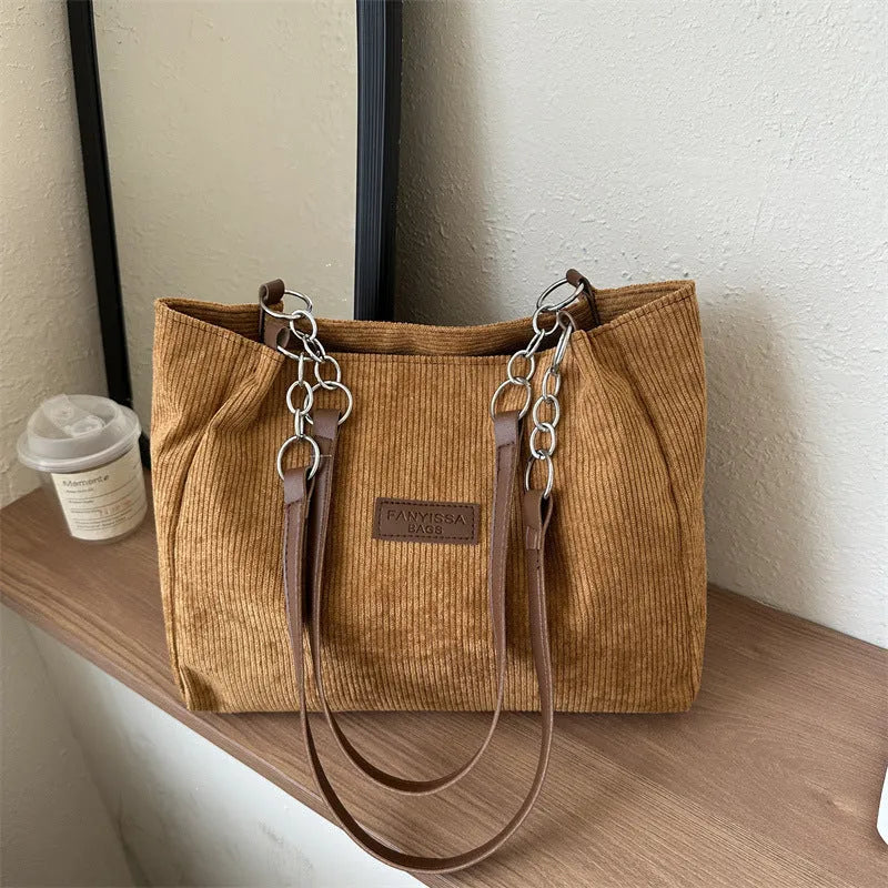 Corduroy women's tote handbag with one-shoulder strap and three-dimensional pocket in horizontal square shape