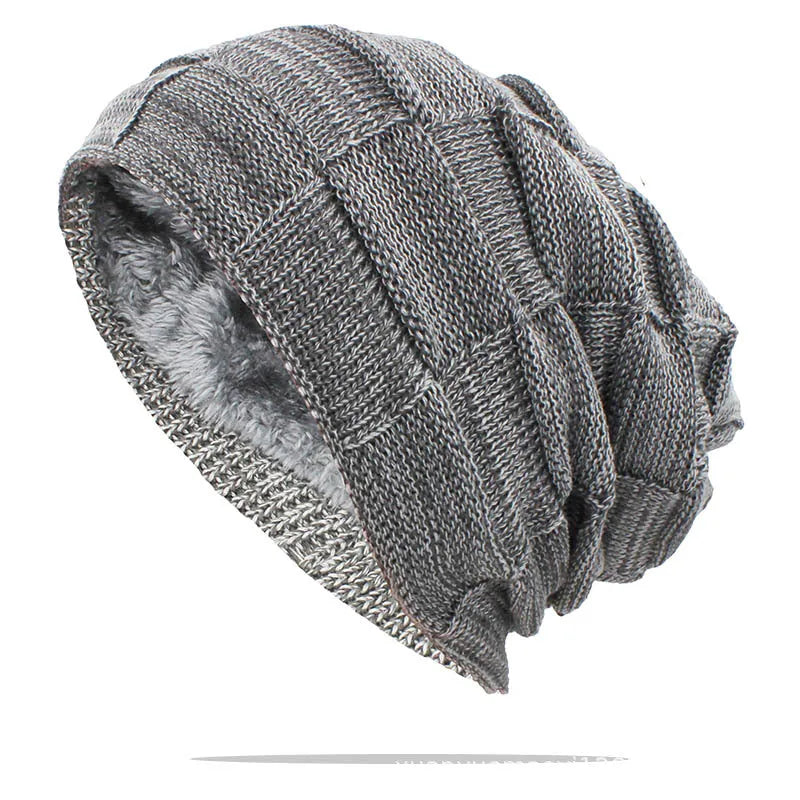 Wool knitted beanie hat in khaki, dome top, brimless style on model