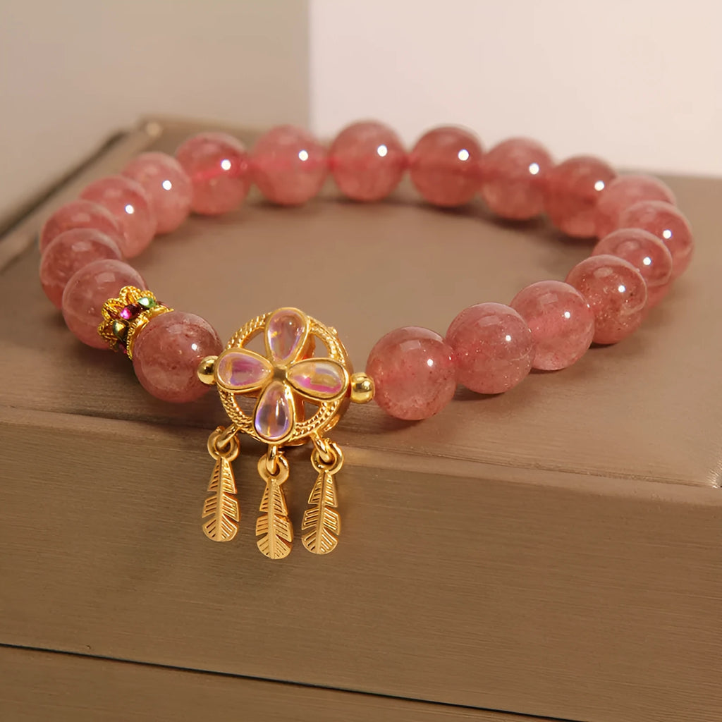Women's crystal bracelet with strawberry quartz four-leaf dream catcher ball pendant