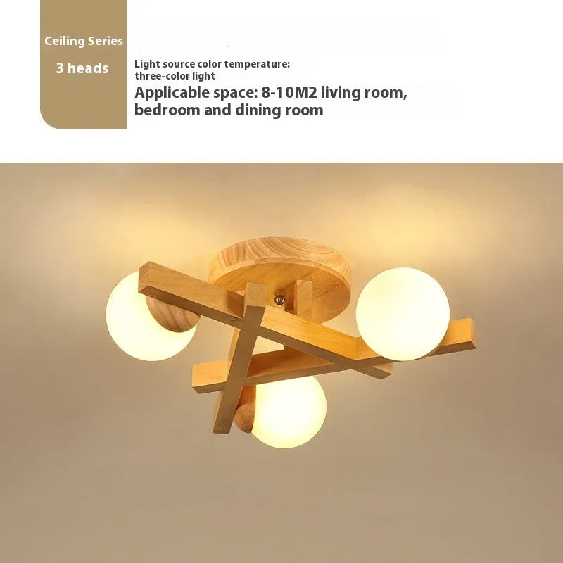 Nordic-style wooden effect ceiling light with three adjustable neutral white LED heads on angled arms.