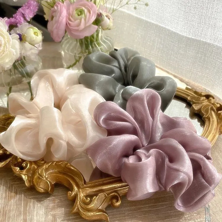 Korean style cloth hair ring with crystal satin finish in light pink colour on a white background