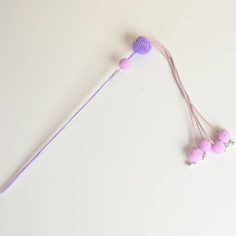 Blue cat toy wand with a fluffy tassel on a stick for interactive pet play.
