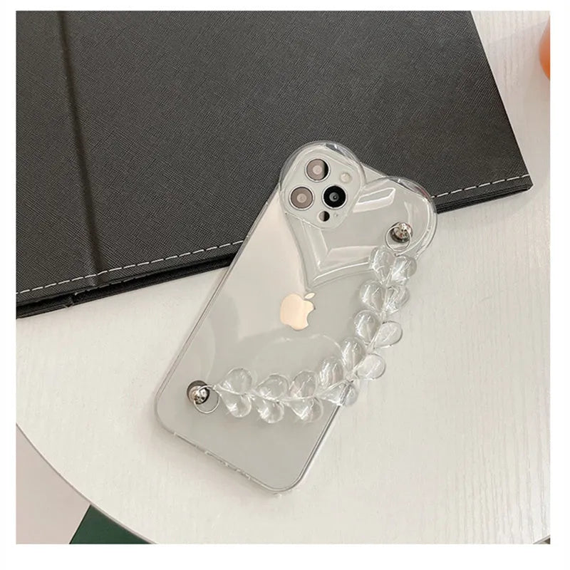 Clear iPhone case with a red love heart and chain design on the back