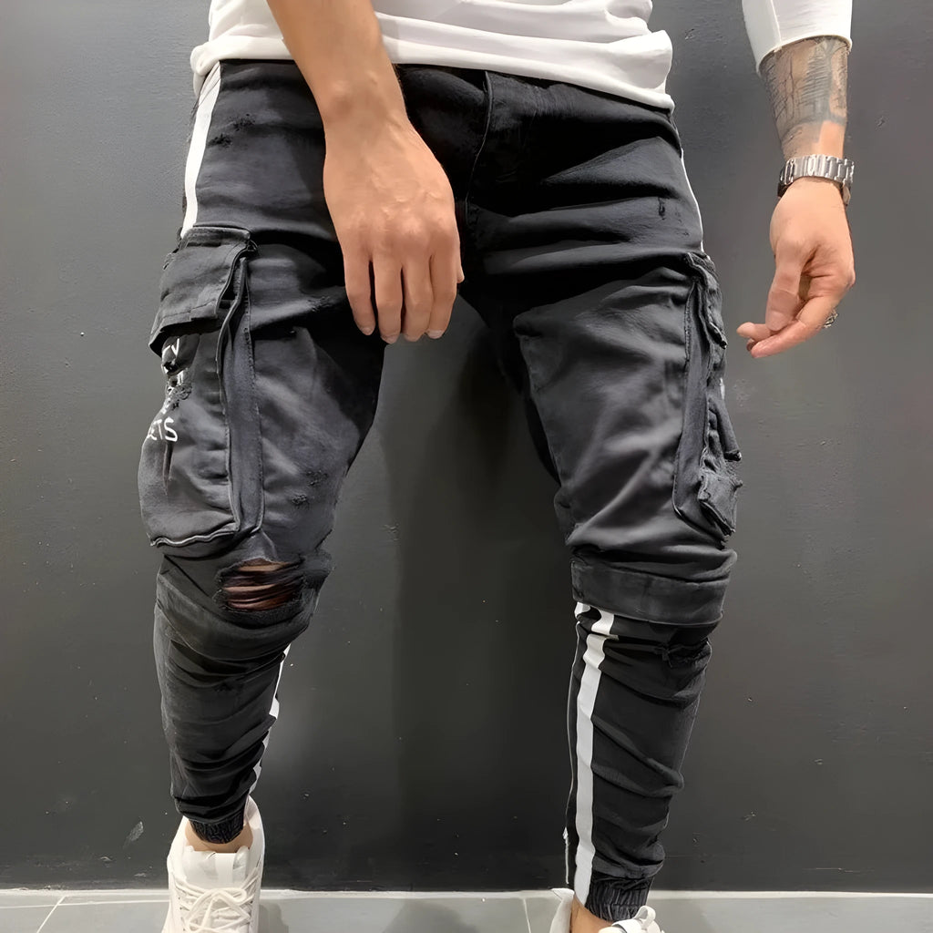 Men's knee-cut denim trousers with zip fly placket, 80% cotton, black or light blue, sizes S to 3XL.