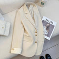 Korean style loose fit women's coat in milky white, showing medium length and pocket details.