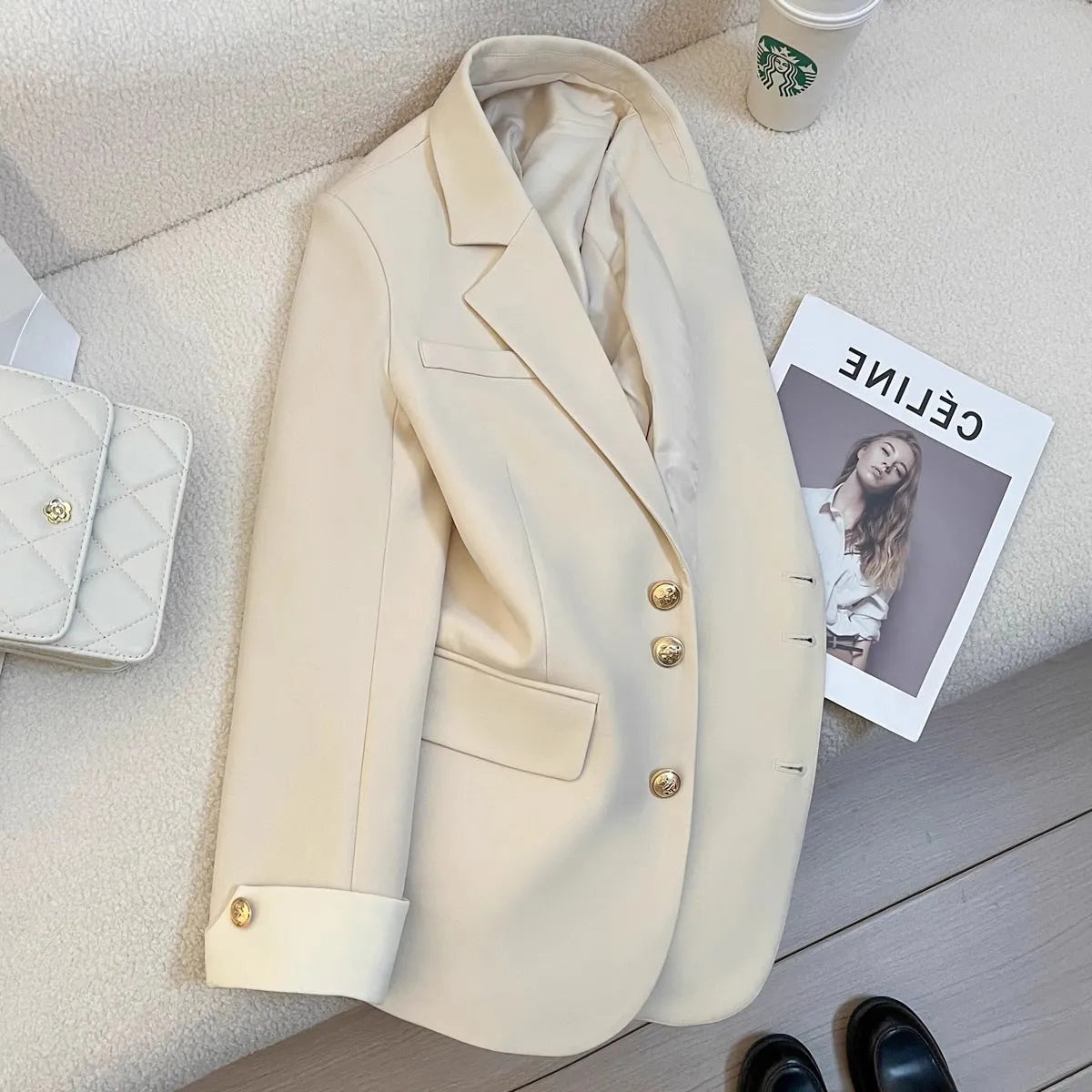 Korean style loose fit women's coat in milky white, showing medium length and pocket details.