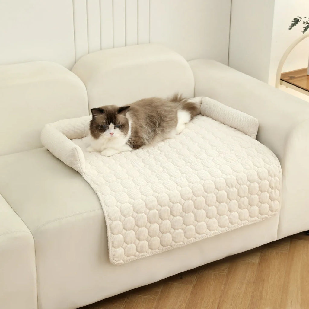 Corduroy pet dog cat bed blanket mat with neck pillow thick soft pad in beige color on a sofa