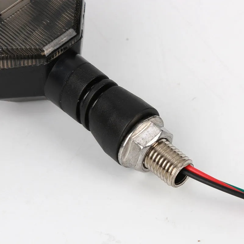 Arrow-shaped LED motorcycle indicator lights showing yellow with blue, red, or white lighting options