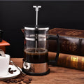 Glass and stainless steel coffee maker with 350ml capacity measuring 10x8x17cm
