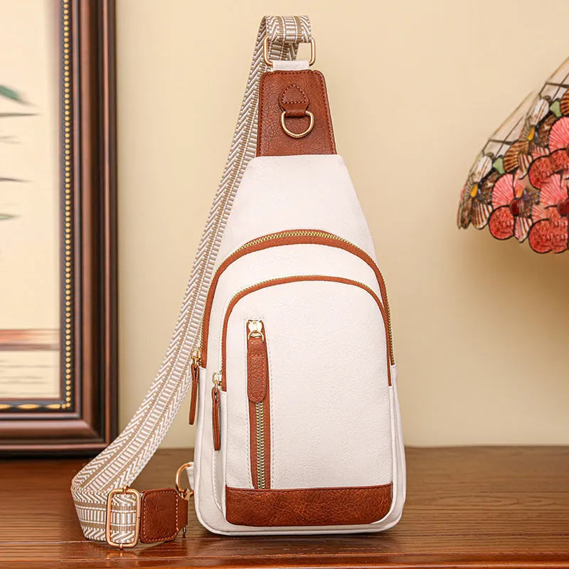 A soft PU women's crossbody messenger bag in beige, shown with an open outer pocket and decorative stitching.