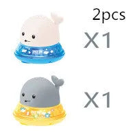 Electric whale-shaped bath spray toy with water-activated automatic spray, LED lights, and floating capability