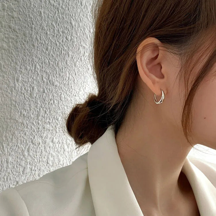 Women's geometric water drop earrings in gold or silver, shown in large, medium, and small sizes.