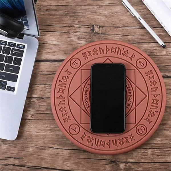 Square black 10W fast wireless charging pad with glowing magic array pattern for Qi phones.