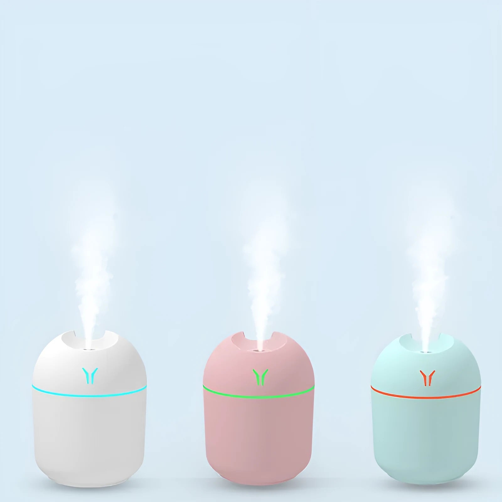 Round desktop humidifier with USB cable and water tank in ivory white, sky blue, or girlish pink colours.