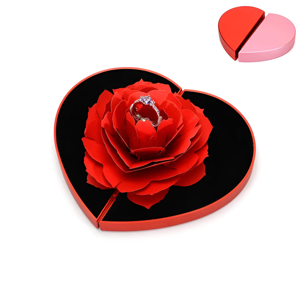 Red rotating 3D heart-shaped plastic ring box with a rose, open to show ring placement.