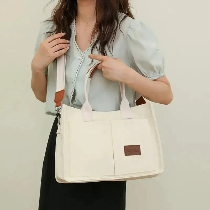 Large capacity canvas tote bag for women with multiple pockets and crossbody strap in creamy white