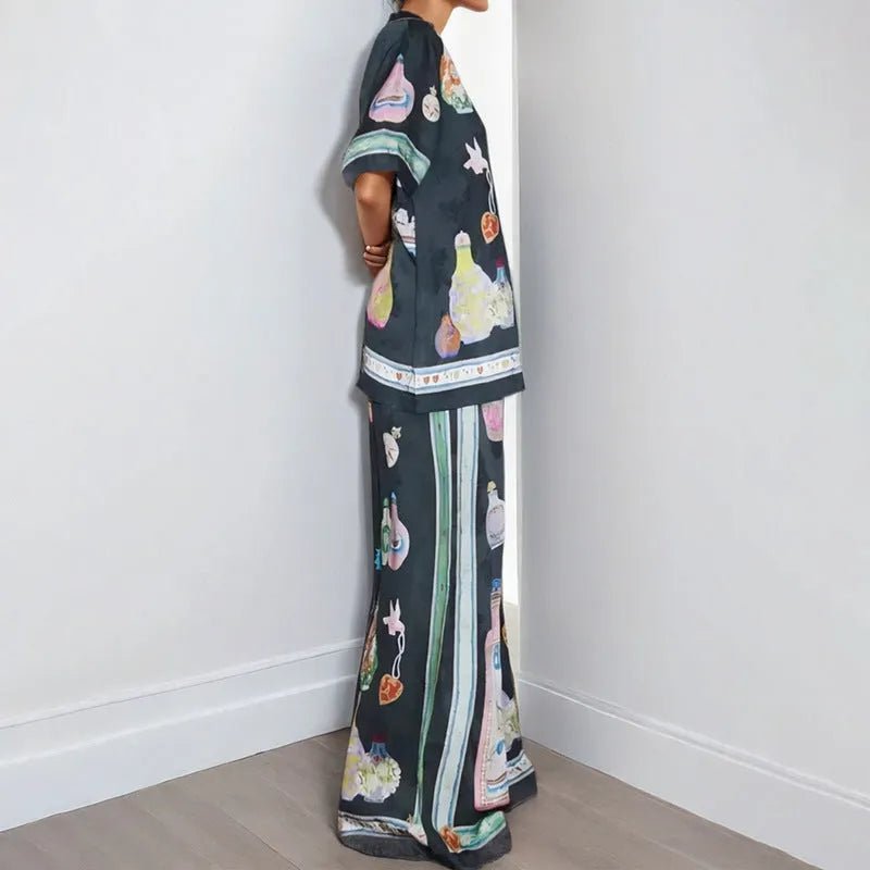 Black women's casual set with cartoon print, featuring a cardigan and matching trousers