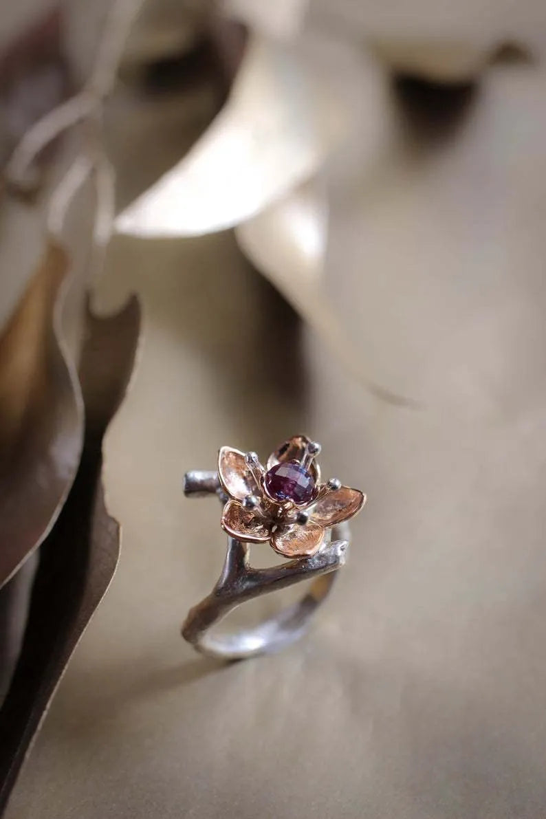 Silver two-tone floral geometric women's fashion ring made from alloy.