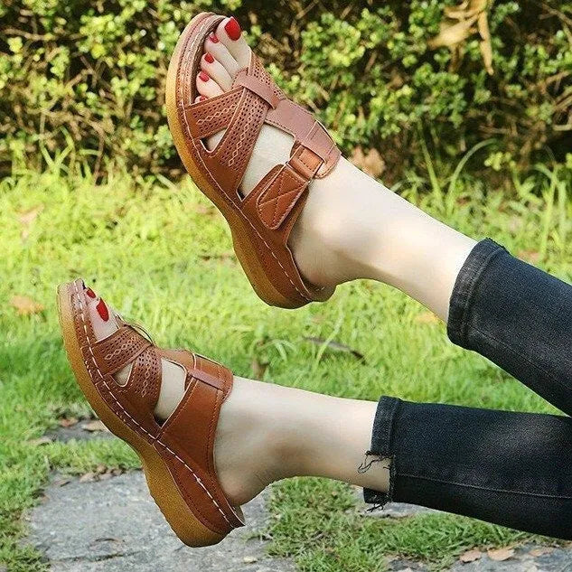 Women's black hollow peep toe wedge sandals with a Velcro strap closure