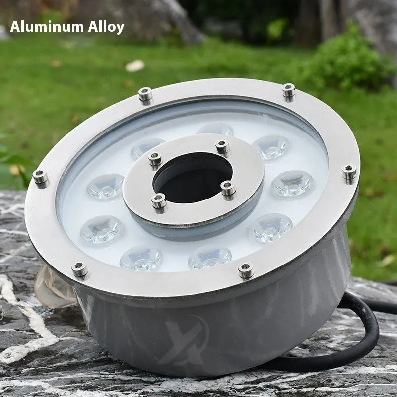 Aluminium alloy outdoor underwater lamp shown illuminated in a garden water feature.
