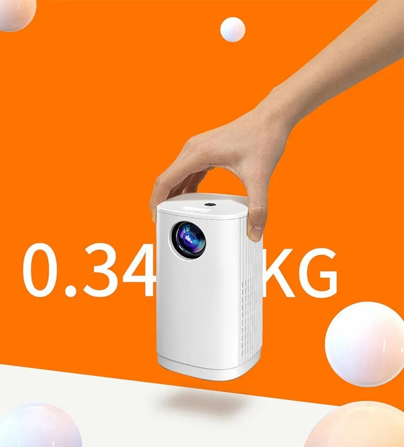 Blue mini projector with remote control on table showing movie projection on wall
