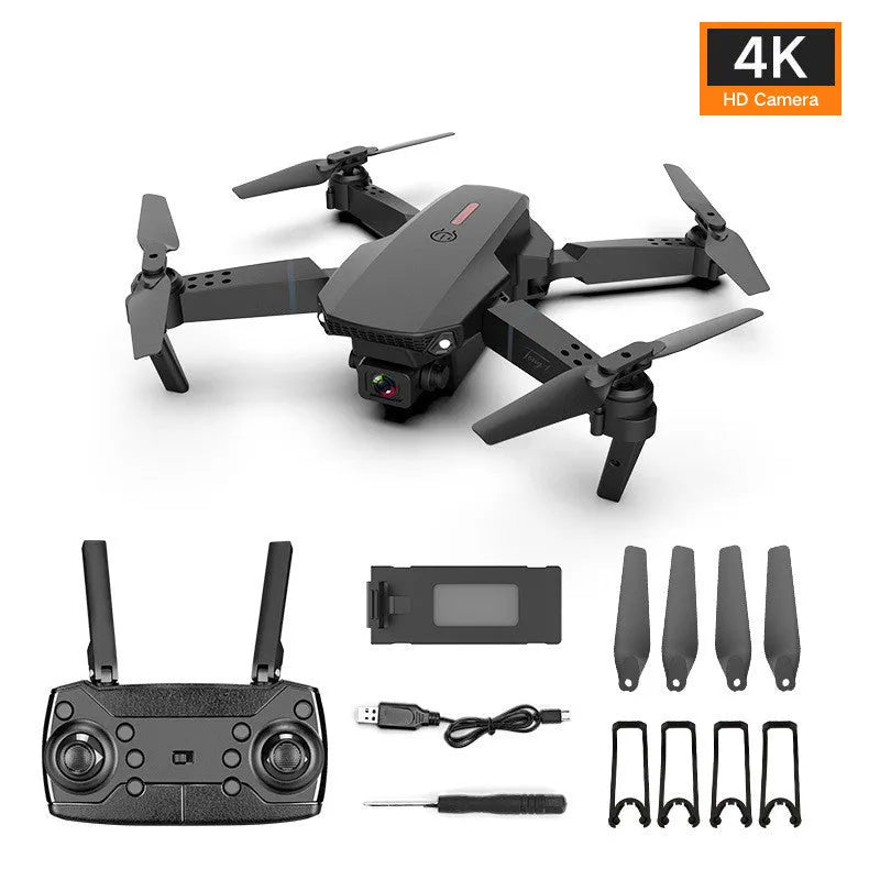 Grey foldable 4K dual camera drone with remote controller and carry bag, shown with propeller blades extended.
