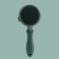 Green 2-in-1 silicone pet grooming brush showing slicker brush side and octopus-teethed massager side