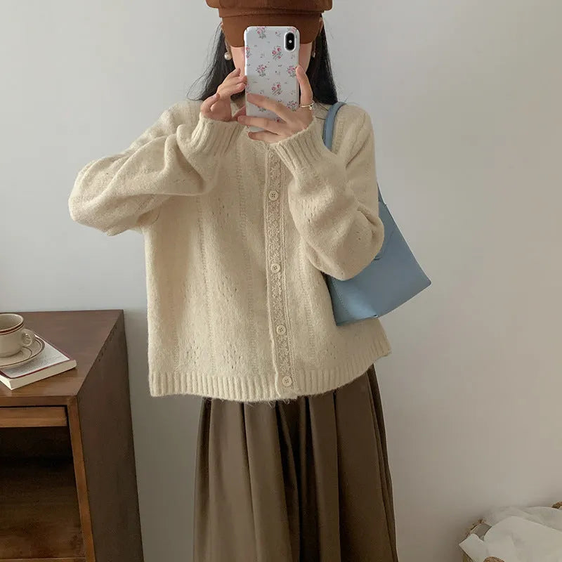 Artistic retro loose-fit sweater coat cardigan in apricot, shown on a model.