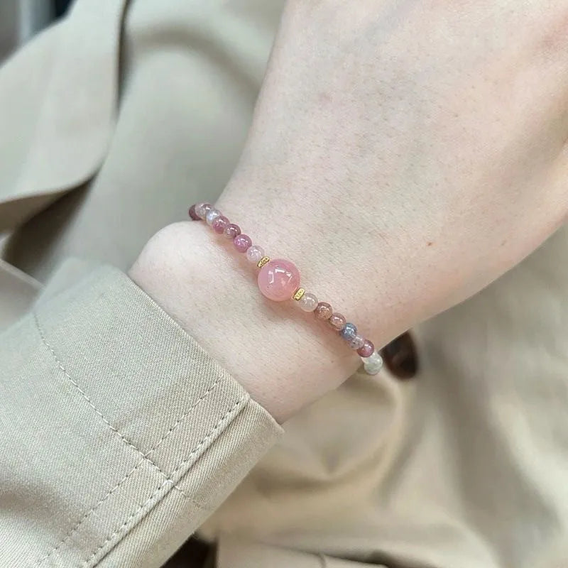 Pink crystal women's bracelet with geometric shape and electroplated finish in colour option selection.