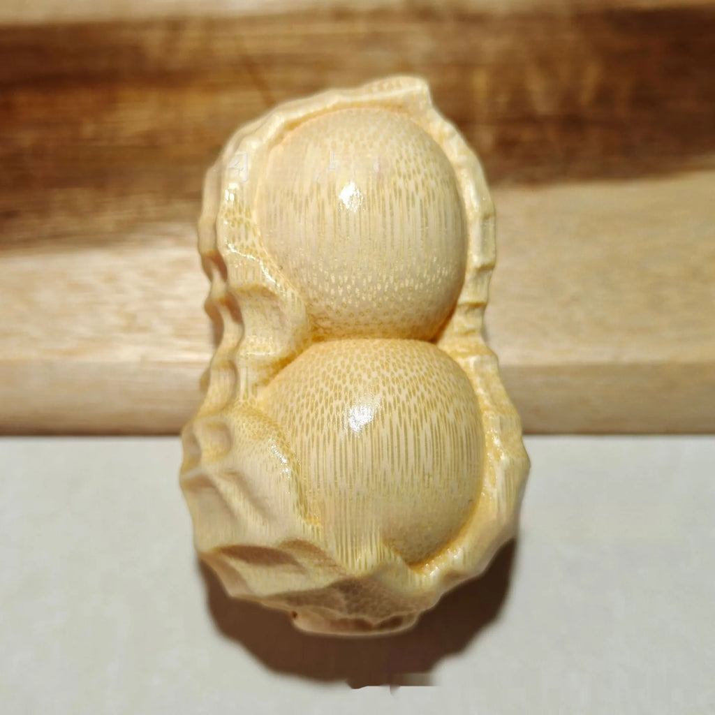 Natural solid bamboo peanut carving ornament with 'May Good Things Happen' inscription