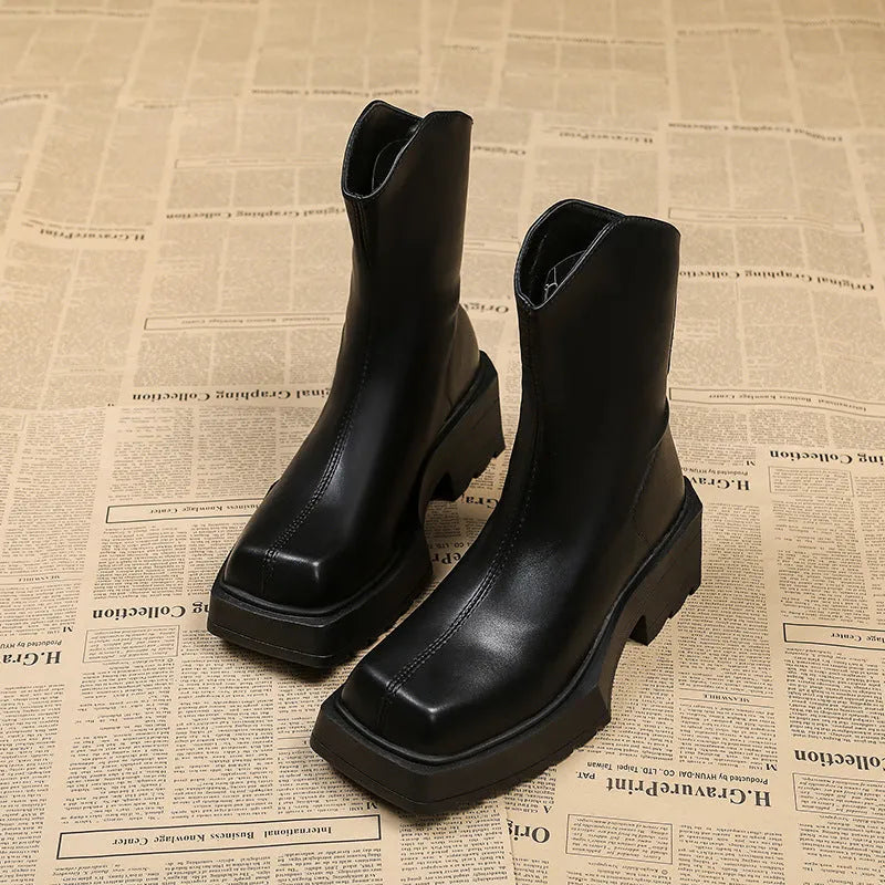 Black platform Martin boots for women with a square toe and back zipper.