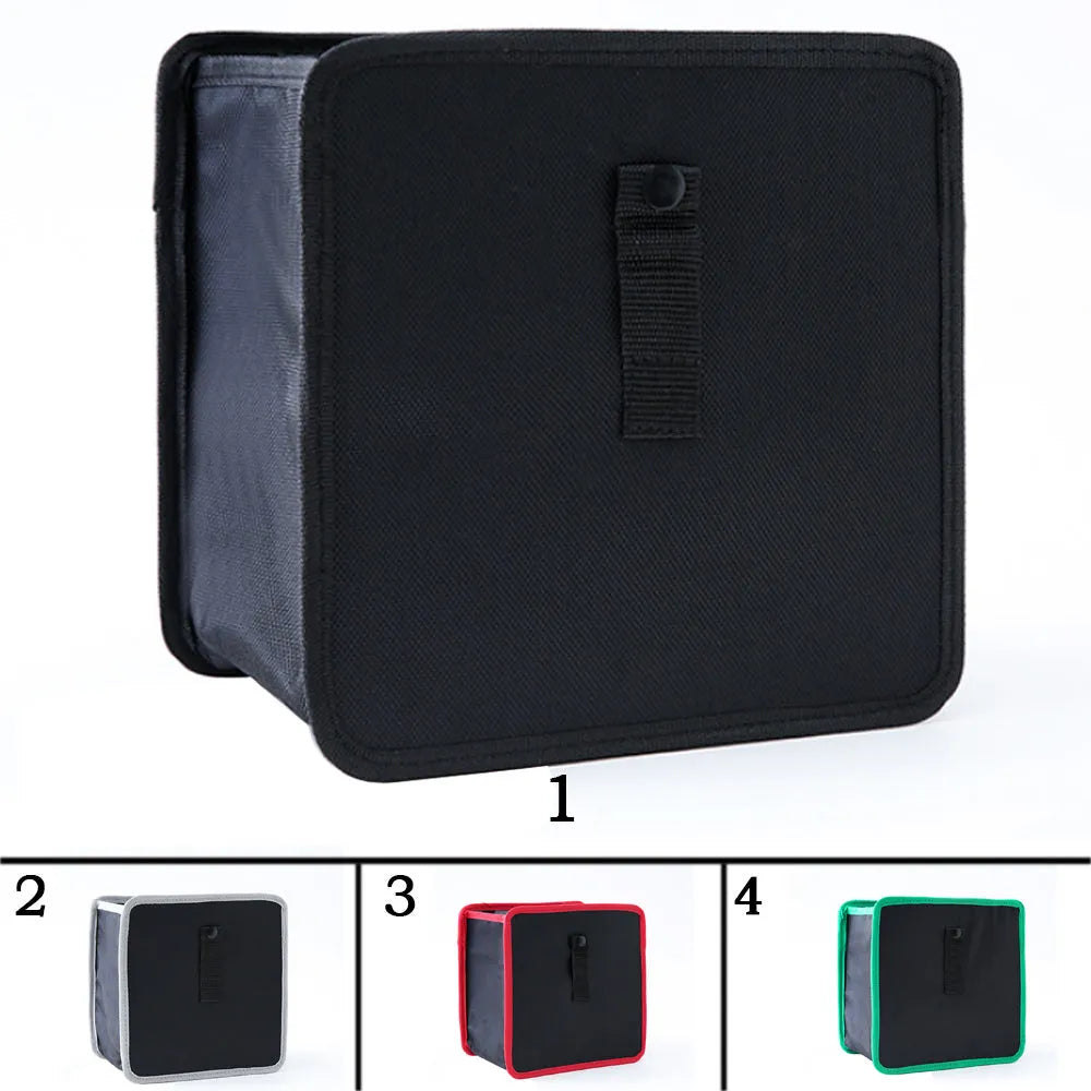 Foldable black Oxford car wastebasket with adjustable strap held on red seat headrest