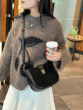 Women's black genuine leather crossbody bag with one-shoulder design and sandwich pocket exterior
