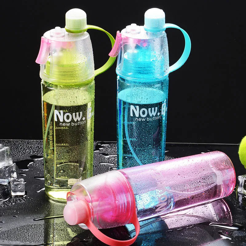 Green portable sports mist spray cup with handle, leakproof lid, and visible scale, shown next to a black version.