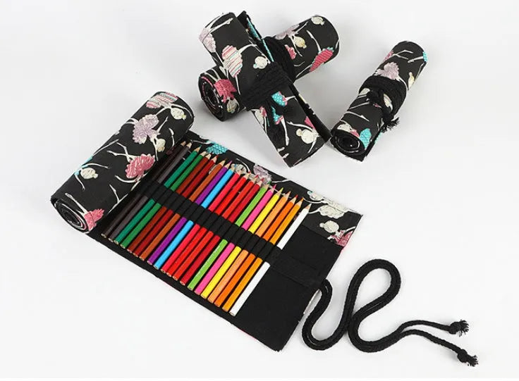 Canvas rolling pencil case with ballet girl print, showing multiple pencils organised in holes.