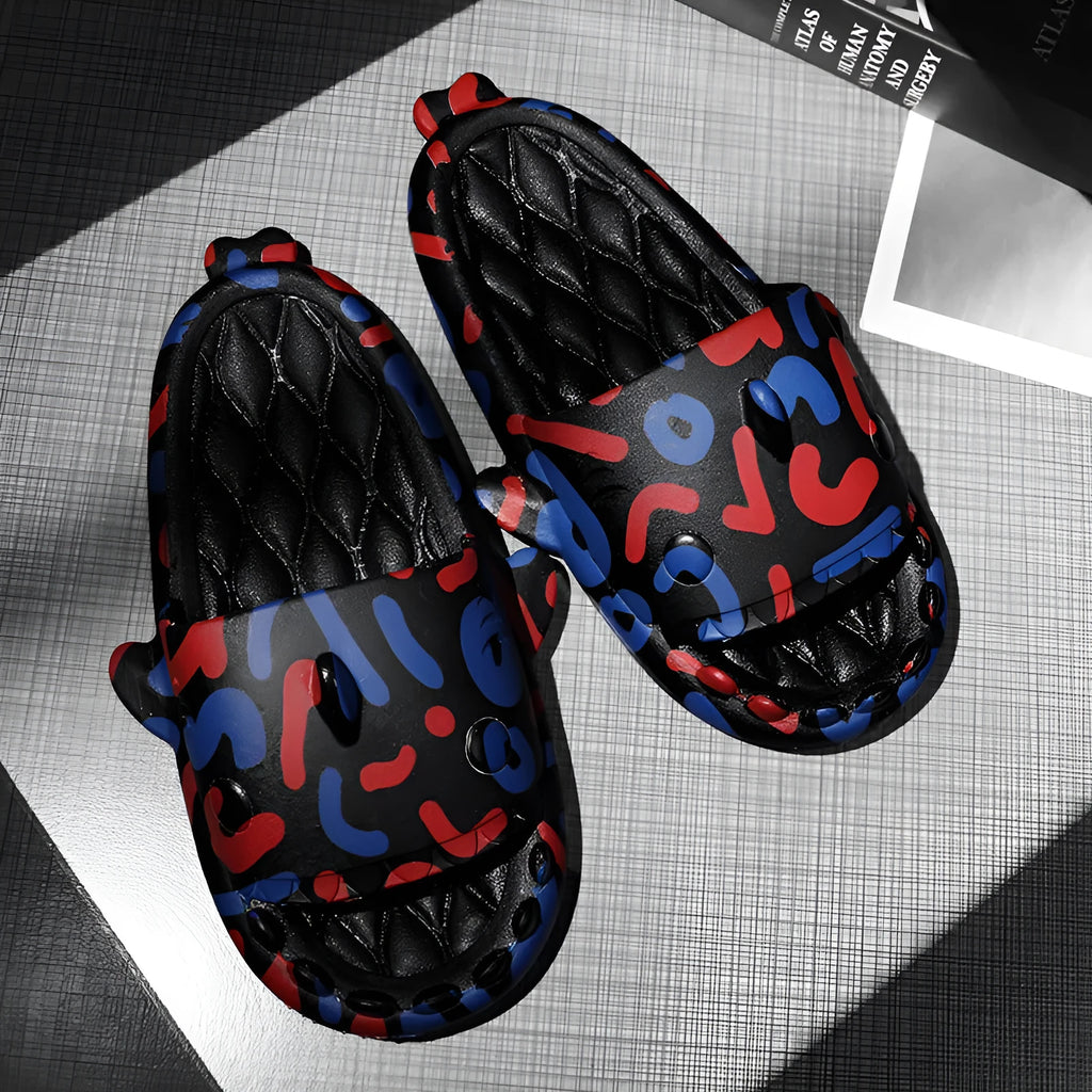 Pair of open-toe EVA home slippers with a shark design on a white background.