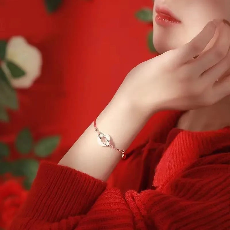 Japanese style festive koi bracelet with red rope, peace buckle, and electroplated finish for women