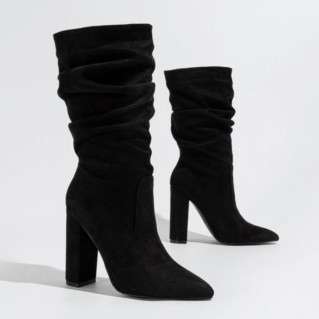 Women's black suede high heel boots with a chunky heel and pointed toe, mid-calf length.