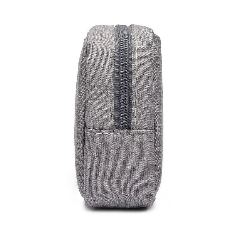 Multi-purpose polyester buggy bag for digital accessories and travel items, shown in gray handbag style