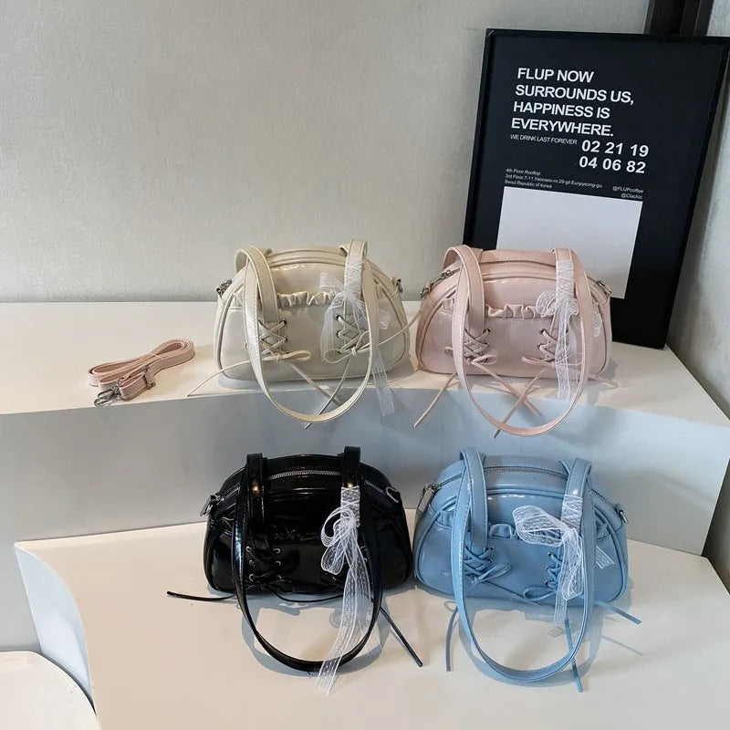 Women's casual PU shoulder handbag with bandage bow design in milky white colour showing sewing thread details