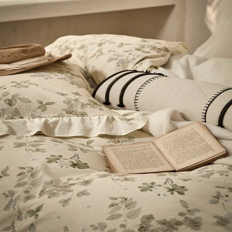Cotton linen yarn-dyed printed four-piece bedding set in Raw Jute Colour with plants and flowers pattern on a bed