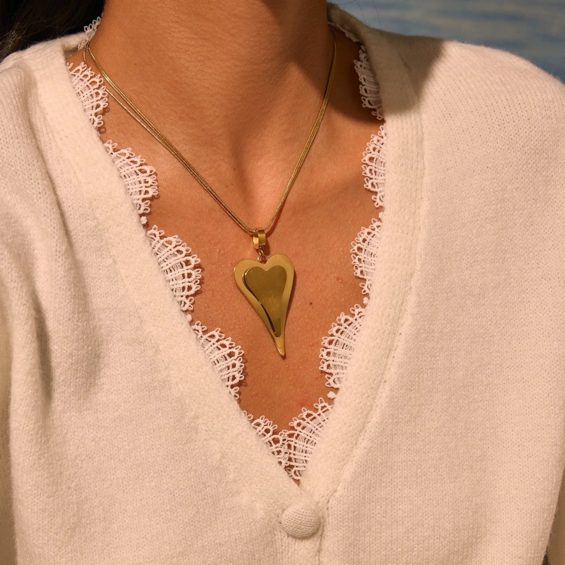 Women's stainless steel snake bones chain necklace with geometric double heart pendant