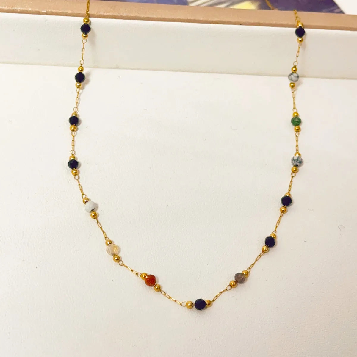 Gold electroplated titanium steel necklace with natural stone pendant on O-ring chain