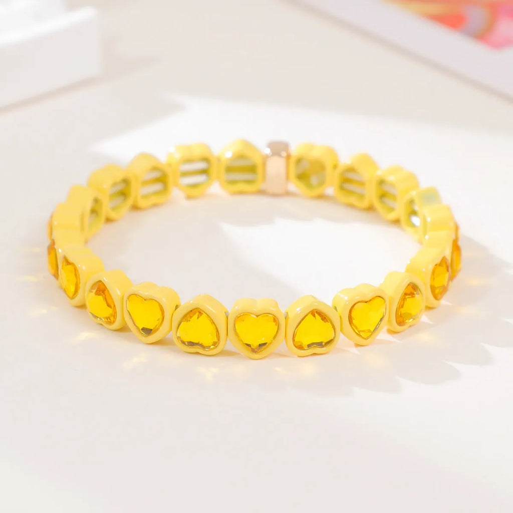 Rainbow enamel alloy heart stretch bracelet showing heart charm with diamond treatment in multiple colour options