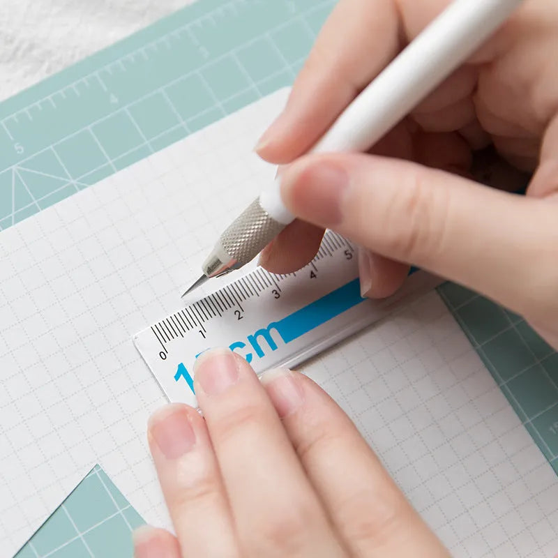 Art pen knife cutting board set with backing board, ruler, sharpener, and blade in blue colour