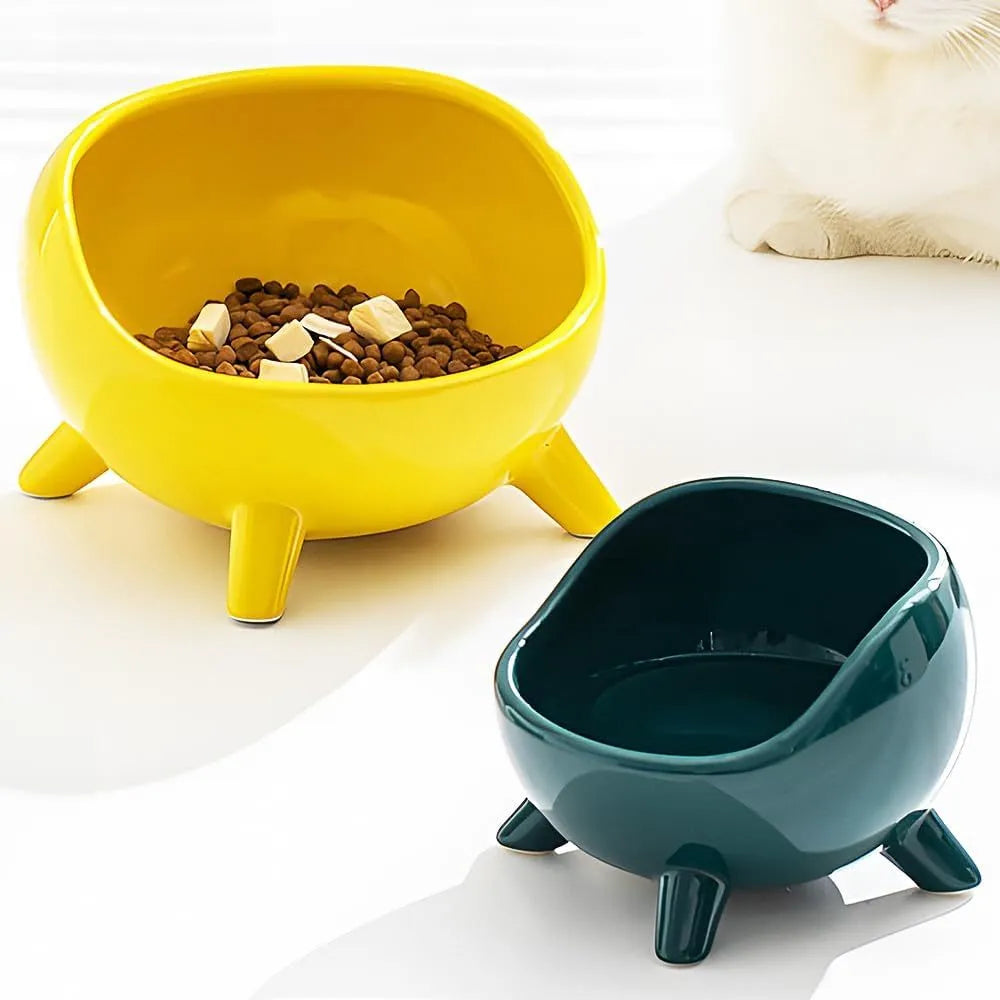 Green ceramic pet bowl with four legs and wide mouth design